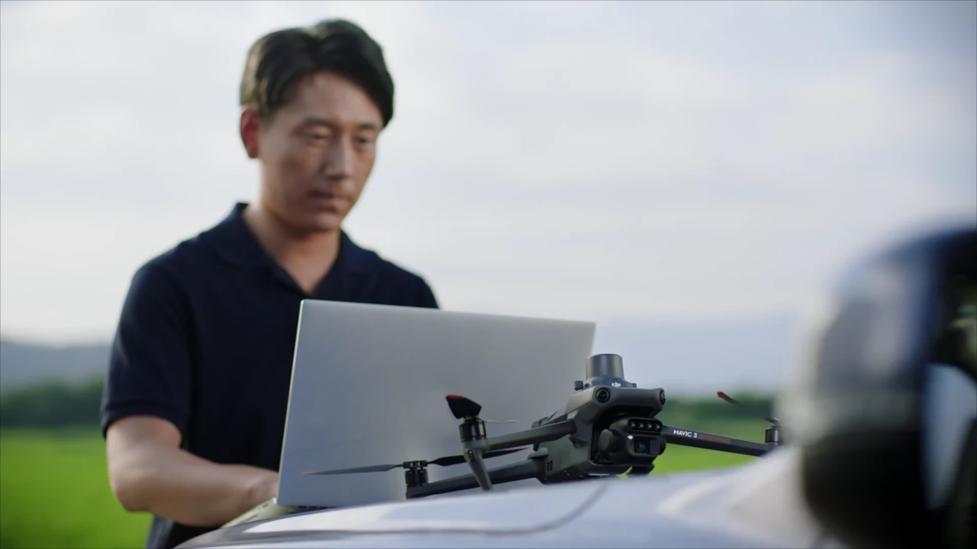 Reviewing information beside a Mavic 3M. DJI demonstration.
